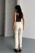جین کمر جذب با پاچه برش خورده بژ