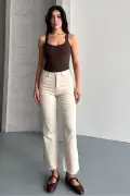 جین کمر جذب با پاچه برش خورده بژ