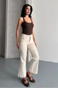 جین کمر جذب با پاچه برش خورده بژ
