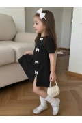 پیراهن مینی مشکی دخترانه با جزئیات پاپیون سفید طراحی مدرن