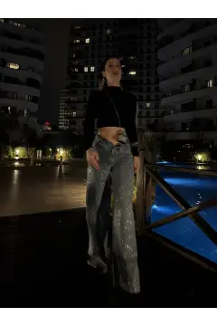 شلوار جین سنگ‌دوزی شده درخشان