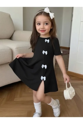 پیراهن مینی مشکی دخترانه با جزئیات پاپیون سفید طراحی مدرن